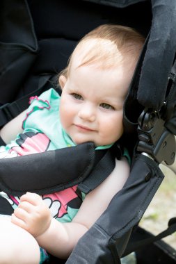Cute White Blond Baby girl on Stroller clipart
