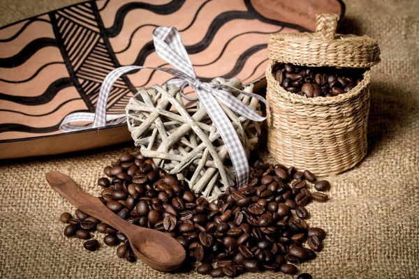 Pile of fresh coffee beans, heart and spoon — Stock Photo, Image