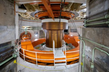Itaipu Binacional, Brazil - June 22 2025: Close-up view of the massive rotor and housing of a power generator unit (U14) inside the Itaipu Dam powerhouse.