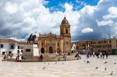 Tunja, Boyaca, Colombia - November 20 2023: The historic Catedral Basilica Metropolitana Santiago de Tunja dominates the Plaza de Bolivar.
