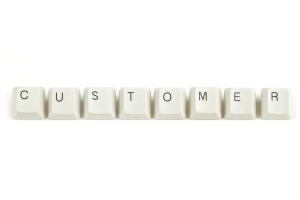 Customer from scattered keyboard keys on white — Stock Photo, Image