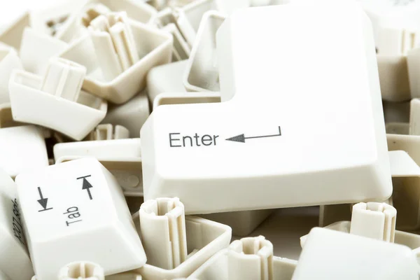 Scattered keyboard keys on white — Stock Photo, Image