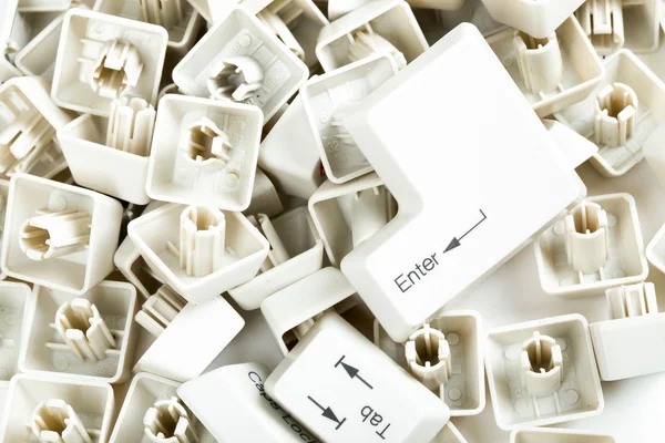 Scattered keyboard keys on white — Stock Photo, Image