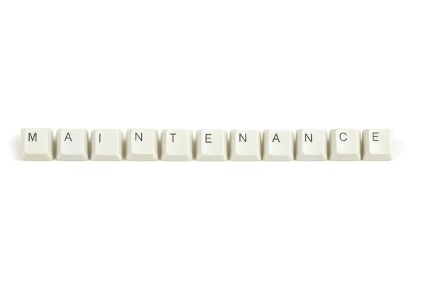 Maintenance from scattered keyboard keys on white — Stock Photo, Image