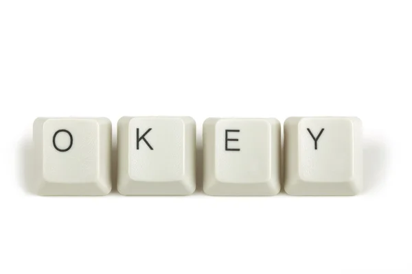 Okey from scattered keyboard keys on white — Stock Photo, Image