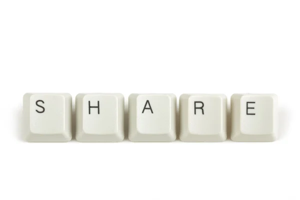 Share from scattered keyboard keys on white — Stock Photo, Image