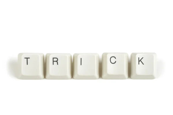 Trick from scattered keyboard keys on white — Stock Photo, Image