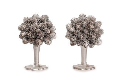 Silver topiary made from fir nob over white background clipart