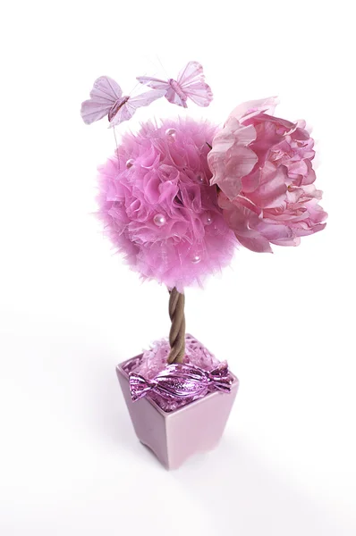 Рожевий топіарій з метеликами і квіткою Стокове Фото