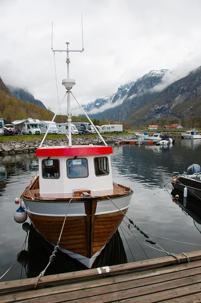 The boat in a fjords harbor — Stock Photo, Image