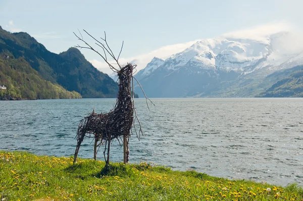 The handmade deer on a fjords shore — Stock Photo, Image