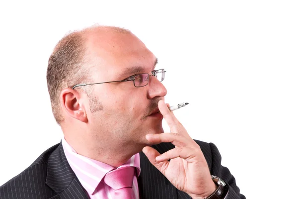 Businessman smoking a cigarette — Stock Photo, Image