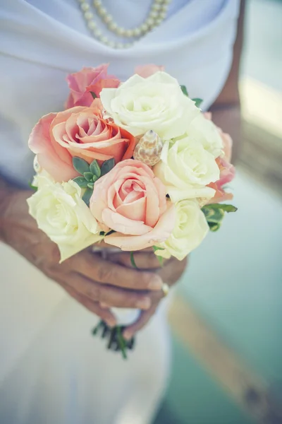 Bride holding flowers Stock Image