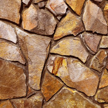 bir arka plan fotoğraf yontma taştan bir duvar parçası.