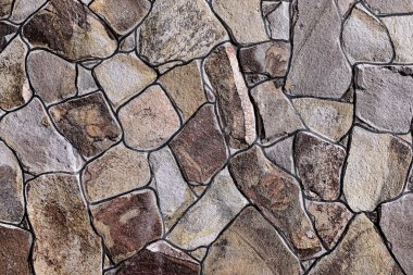 Çatlamış bir taştan bir duvar parçası.