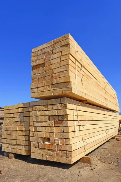 An edging board in stacks in an industrial landscape — Stock Photo, Image