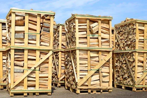 Chipped fire wood in packing on pallets — Stock Photo, Image