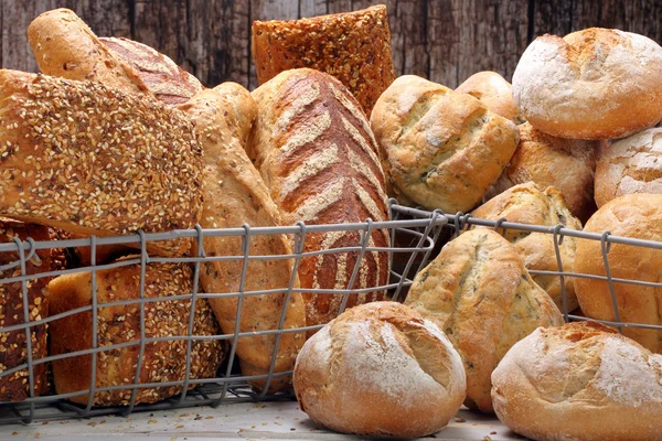 Many different types of bread in metal baskets — Φωτογραφία Αρχείου