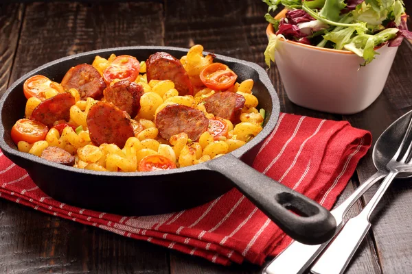 Casserole with chorizo sausage in a frying pan — Stock Photo, Image