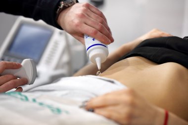 POZNAN, POLAND - APRIL 12. 2016: The doctor examines the patient