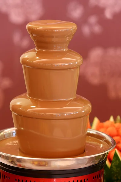 Chocolate fountain on the party or wedding reception — Stock Photo, Image