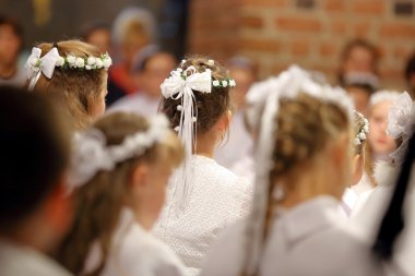 Children going to the first holy communion clipart