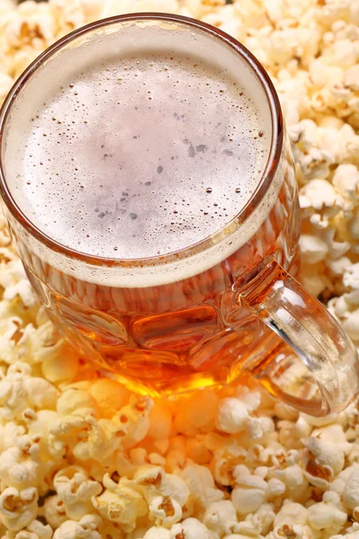 Pint of beer and popcorn with space for text