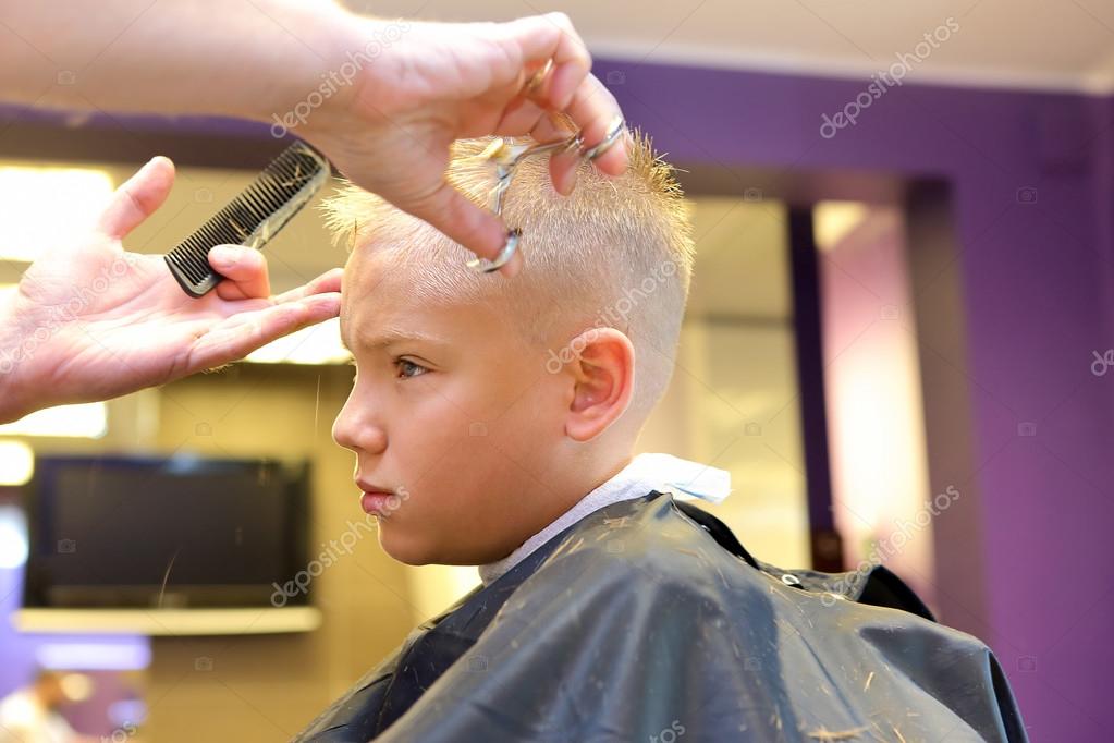 Hairdresser trimming blonde hair of young boy by scissors Stock Photo by ©wideonet 52096743 Hairdresser trimming blonde hair of young boy by scissors Stock Photo by ©wideonet 52096743