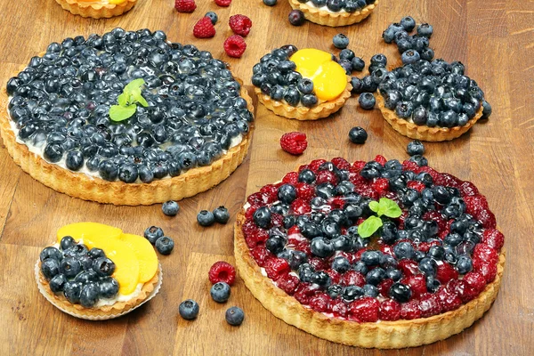 Fruit tart dessert with raspberries blackberries and cranberries