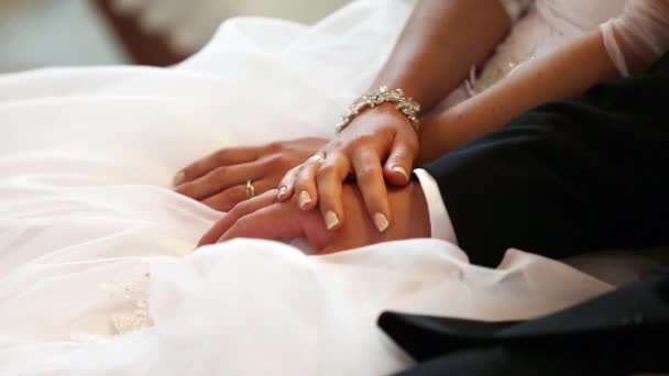 Hands of bride and groom with rings after wedding ceremony — Stock Video