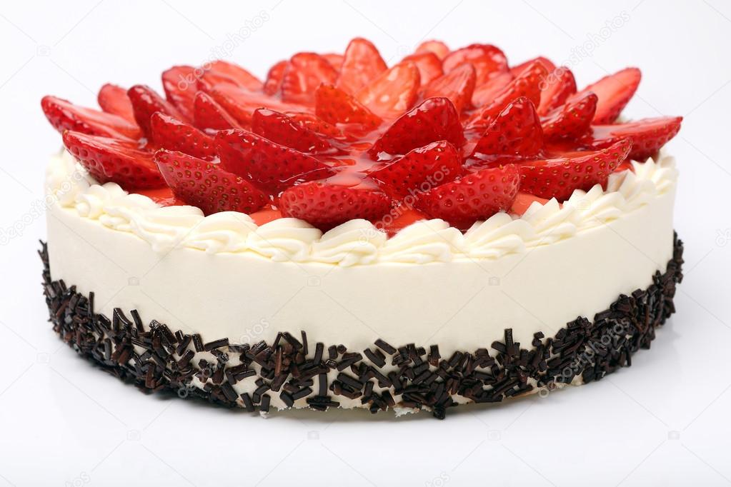 Cream cake with strawberries on white background