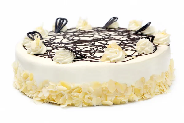 Torta alla crema di mandorle con ciliegina al cioccolato su sfondo bianco — Foto Stock