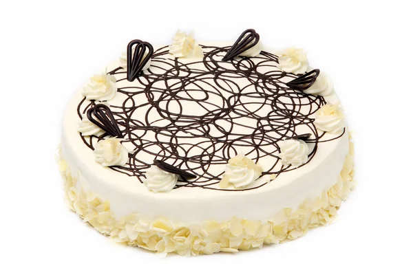 Sahne-Mandelkuchen mit Schokoladenglasur auf weißem Hintergrund — Stockfoto