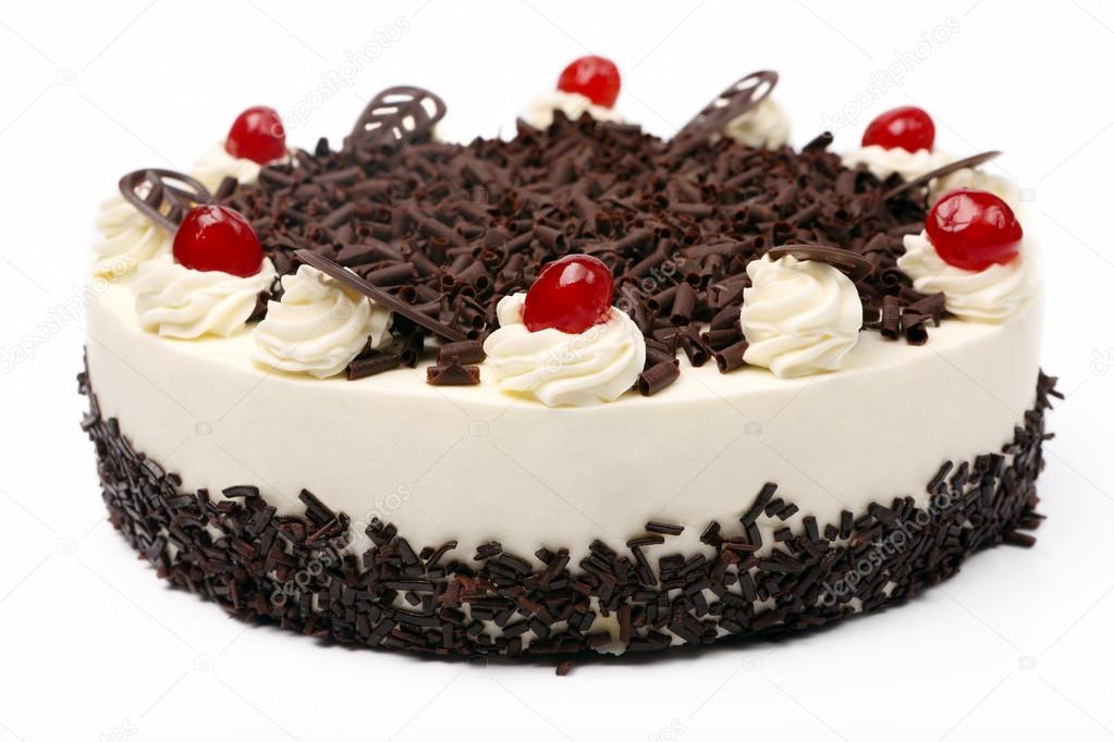 Cream vanilla cake with chocolate and cherries on white backgrou