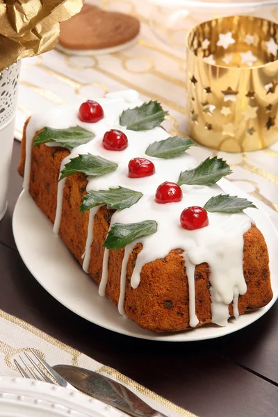 Christmas holly fruitcake on the table — Stock Photo, Image