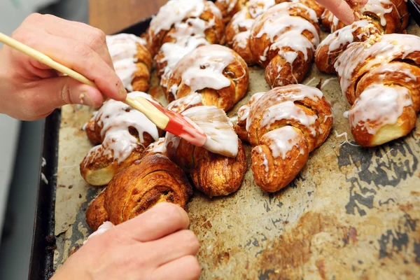 Fresh croissants iced with delicious cream — Stock Photo, Image