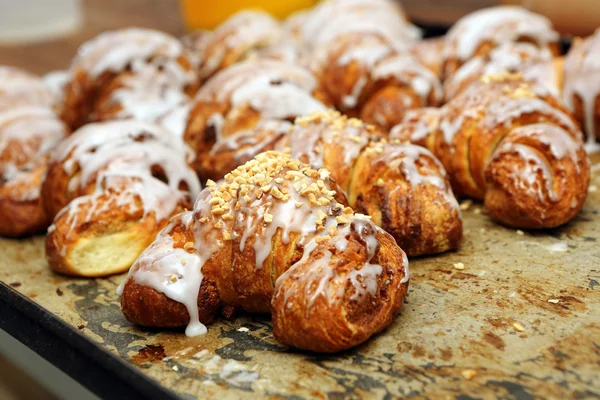 Fresh croissants iced with delicious cream — Stock Photo, Image