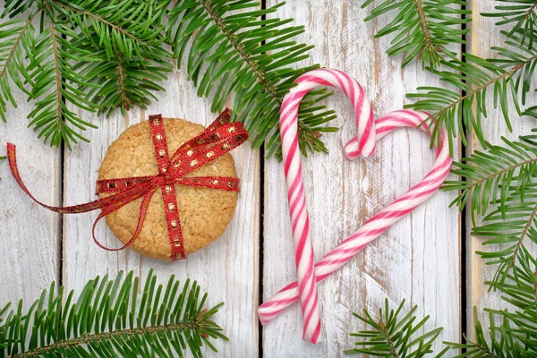 Christmas cookies with decoration on wooden background — Stock Photo, Image