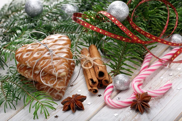 Christmas gingerbread with decoration on wooden background — Stock Photo, Image