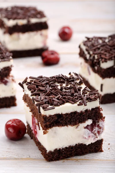 Creamy cake with cherries and chocolate topping. Catering set. — Stock Photo, Image