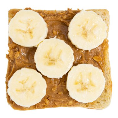 Beyaz arka planda fıstık ezmeli ve muzlu tost..