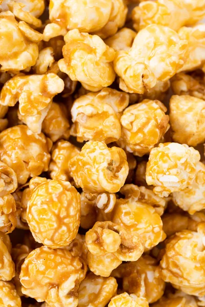 caramel popcorn texture background. Sweet caramel popcorn close-up.
