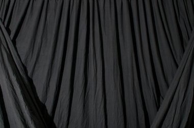 Draped black background fabric clipart
