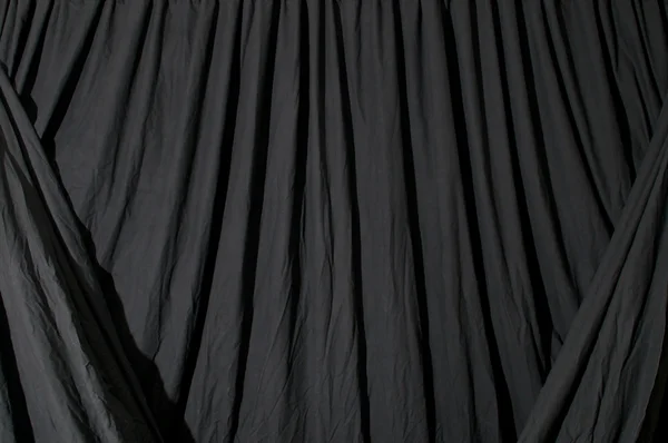 Draped black background fabric — Stock Photo, Image