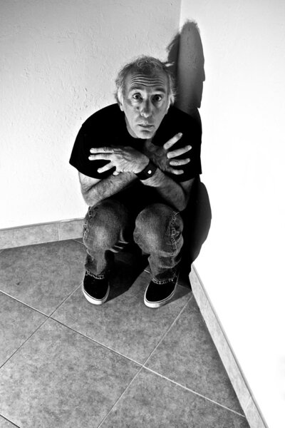 scared man appearing to be pleading for something