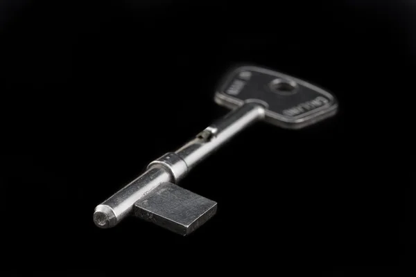 Boş anahtar üstünde siyah izole — Stok fotoğraf
