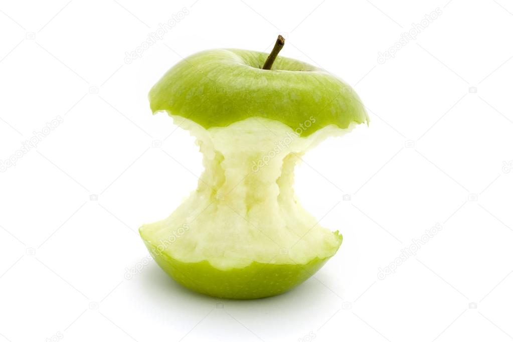 Green apple core over white