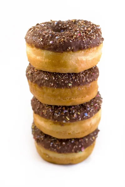 Stack of chocolate doughnuts over white — Stock Photo, Image