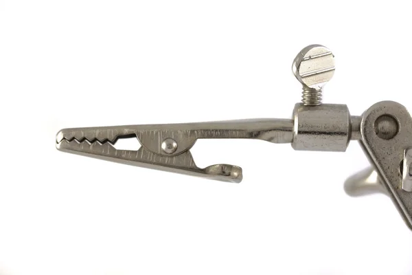 Close up of a crocodile clip — Stock Photo, Image