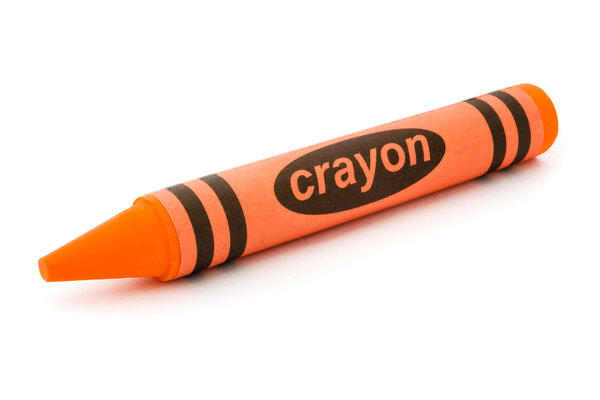 Single orange crayon isolated on white